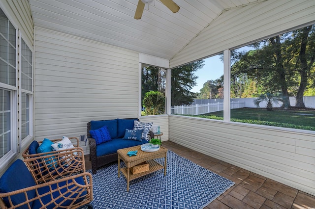 sunroom / solarium featuring ceiling fan, vaulted ceiling, and wood ceiling