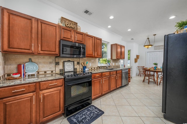 kitchen featuring light tile patterned flooring, black appliances, stone countertops, crown molding, and sink