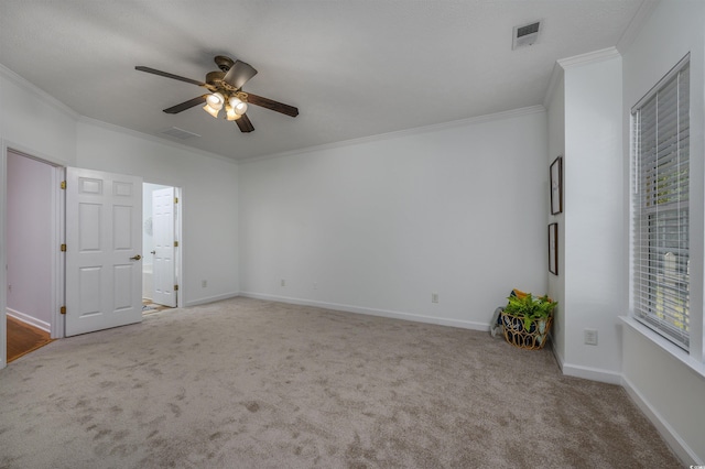 unfurnished room featuring ornamental molding, carpet floors, and ceiling fan