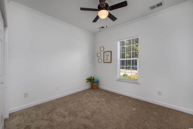 carpeted empty room featuring crown molding and ceiling fan