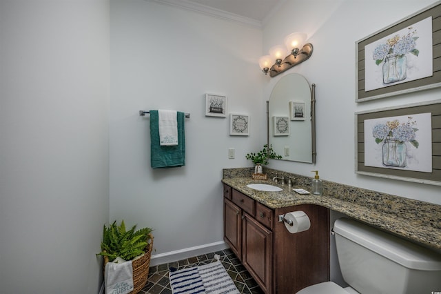 bathroom featuring vanity, ornamental molding, toilet, and tile patterned flooring