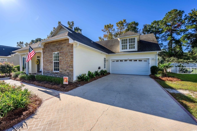 view of front of property with a garage