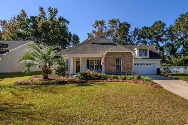 view of front of property featuring a front yard and a garage