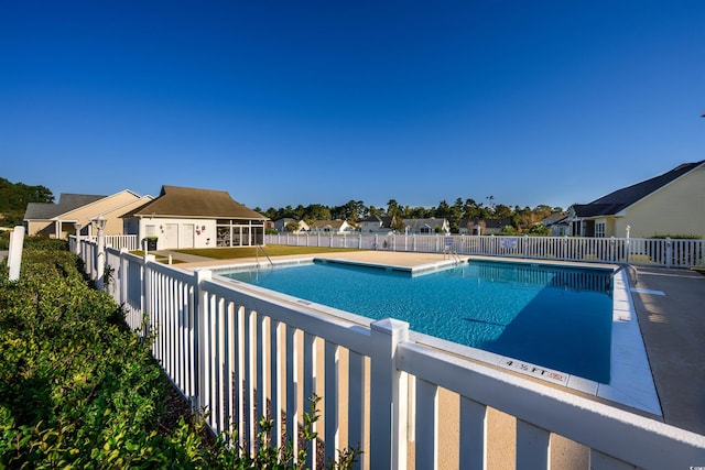 view of swimming pool with a patio