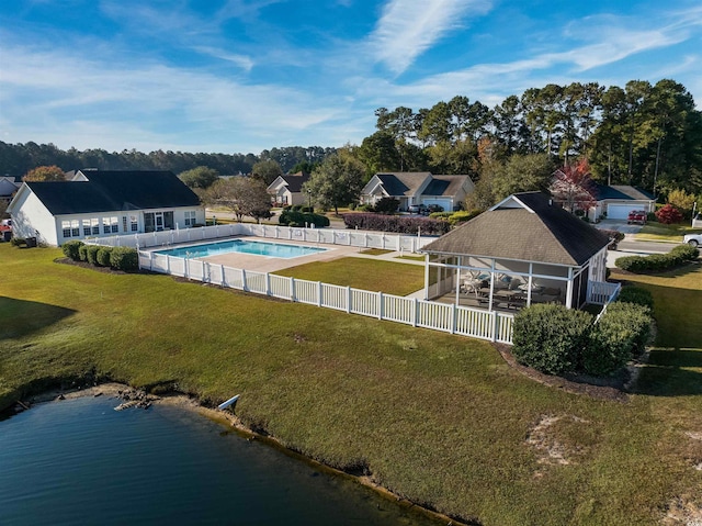 exterior space with a yard and a water view