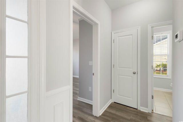 hall with dark hardwood / wood-style floors