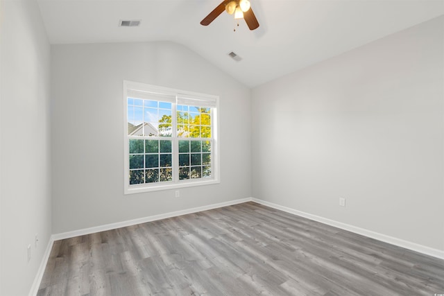 unfurnished room with light hardwood / wood-style flooring, ceiling fan, and vaulted ceiling