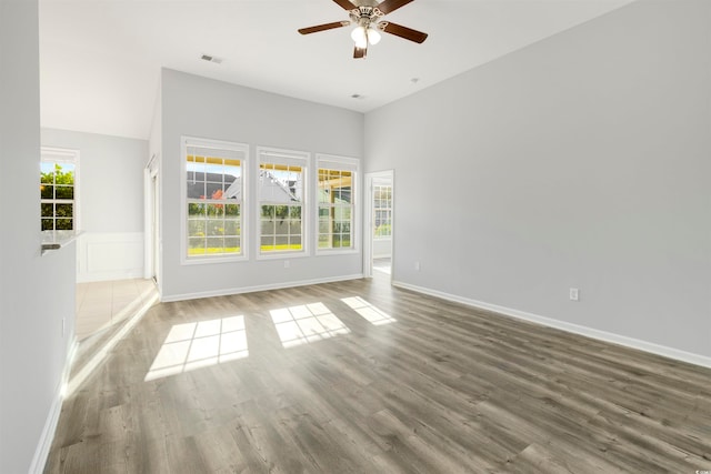 empty room featuring ceiling fan and wood-type flooring