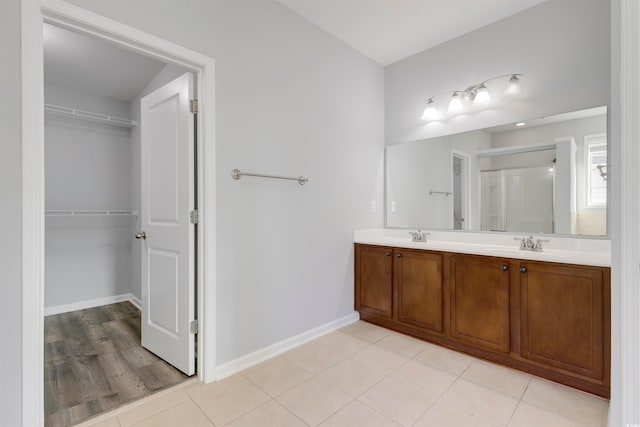 bathroom featuring vanity and hardwood / wood-style flooring