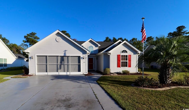 view of front facade with a front lawn and a garage