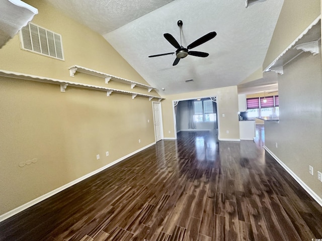 196 Marsh Hawk Dr, Myrtle Beach, SC 29588 - unfurnished living room featuring wood finished floors, ceiling fan, vaulted ceiling, and a textured ceiling