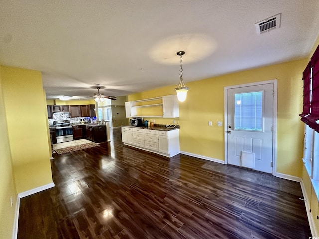 196 Marsh Hawk Dr, Myrtle Beach, SC 29588 - kitchen with electric stove, dark wood-type flooring, white cabinetry, and pendant lighting