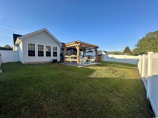 196 Marsh Hawk Dr, Myrtle Beach, SC 29588 - back of house with a pergola, a fenced backyard, and a patio