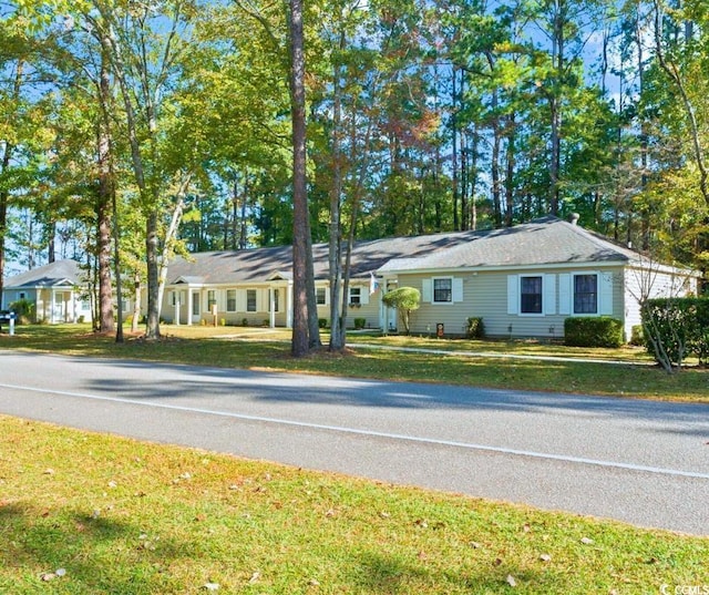 ranch-style home with a front lawn