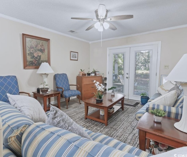 living room featuring ceiling fan, french doors, crown molding, and a textured ceiling