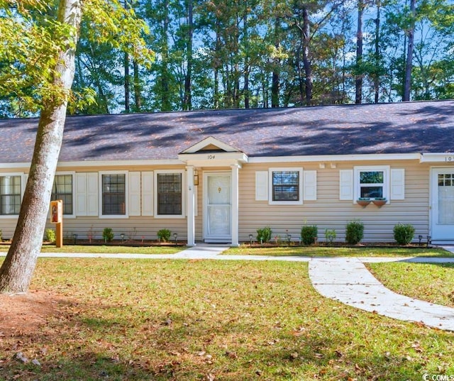 ranch-style house with a front yard