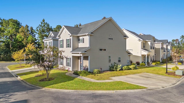 view of front of house featuring a front yard and a residential view