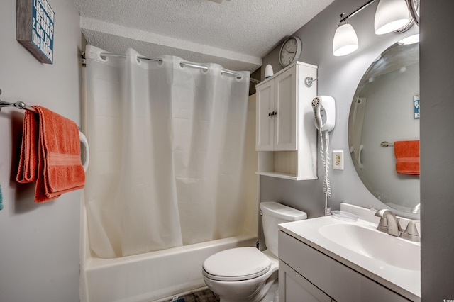 full bathroom featuring toilet, a textured ceiling, shower / bath combination with curtain, and vanity