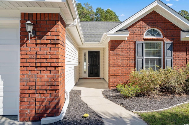 property entrance with a garage