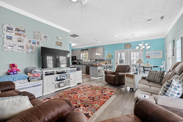 6001-7038 S Kings Hwy, Myrtle Beach, SC 29575 - living area featuring a chandelier, crown molding, a textured ceiling, light wood-style floors, and ceiling fan