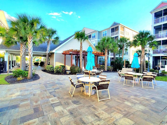 view of property's community with a patio