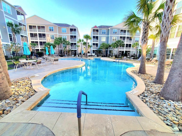 view of pool featuring a patio