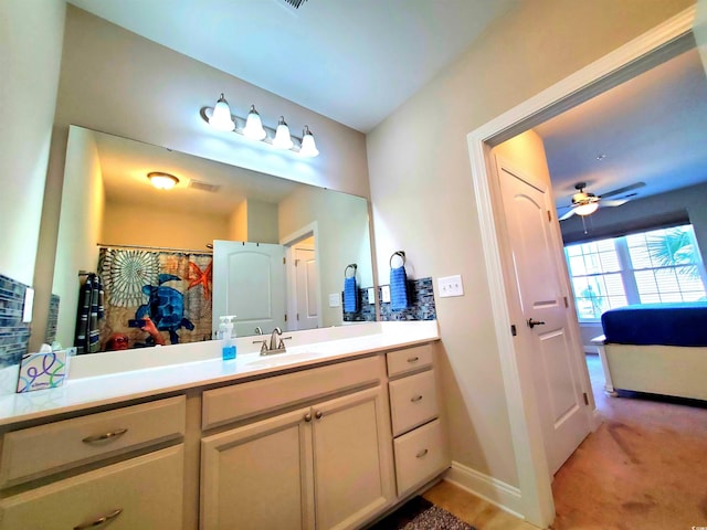 bathroom featuring vanity and ceiling fan