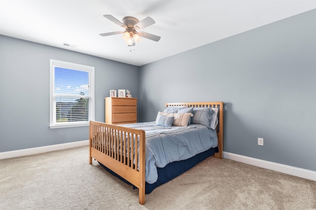 carpeted bedroom featuring ceiling fan