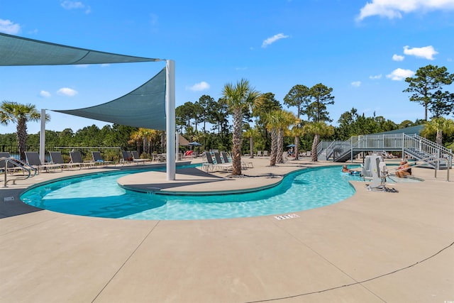 view of swimming pool featuring a patio