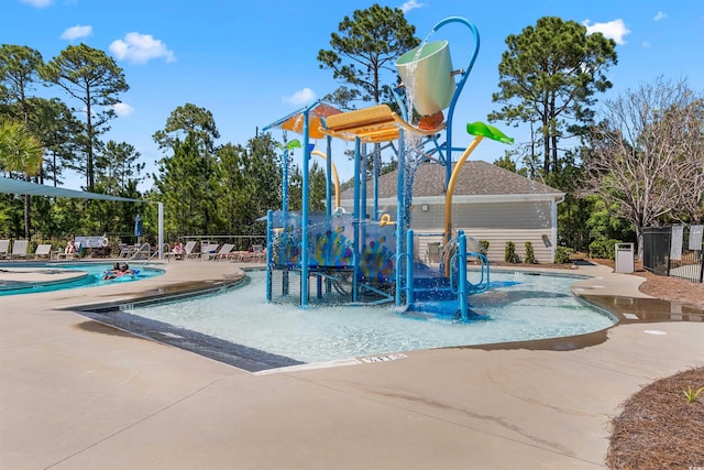 view of play area with a patio area and a community pool