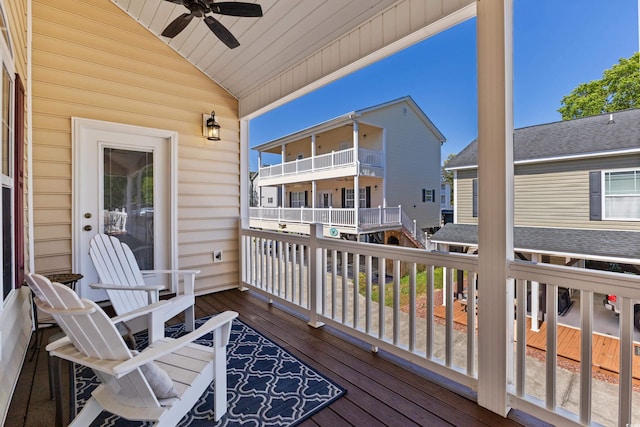 wooden terrace featuring ceiling fan