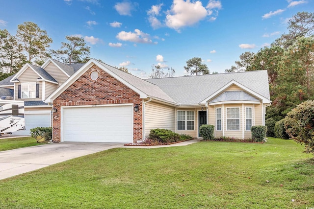 view of front facade with a garage and a front lawn