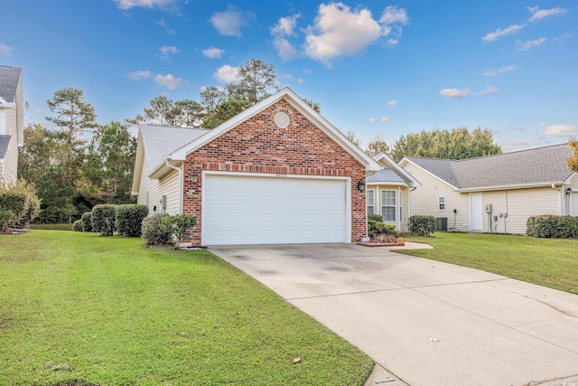 view of property featuring a front lawn and a garage