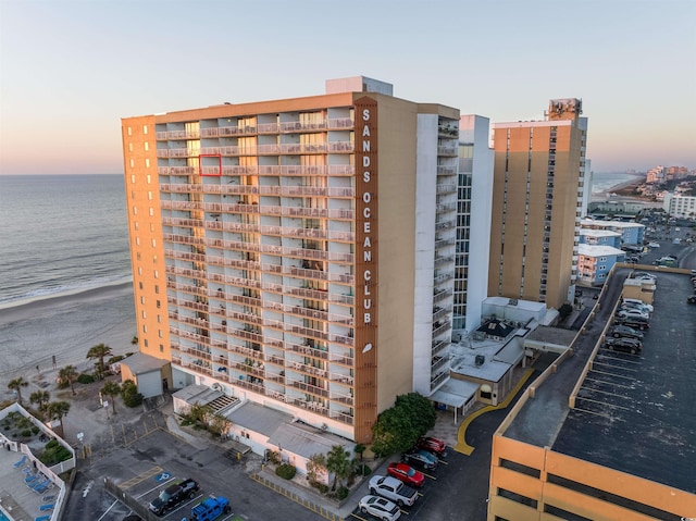 outdoor building at dusk featuring a water view