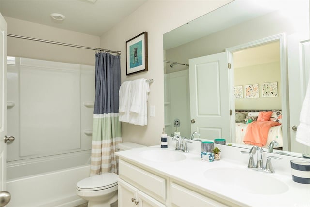 full bathroom featuring vanity, toilet, and shower / tub combo