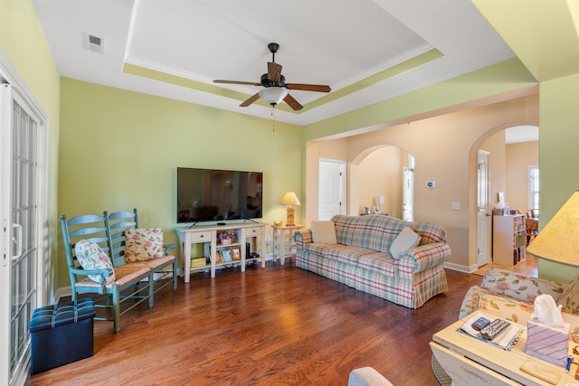 237 Cloverleaf Dr, Longs, SC 29568 - living area with ceiling fan, visible vents, arched walkways, wood finished floors, and a raised ceiling