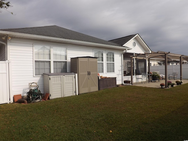 237 Cloverleaf Dr, Longs, SC 29568 - rear view of house featuring an outbuilding, a patio, a storage unit, a yard, and a pergola