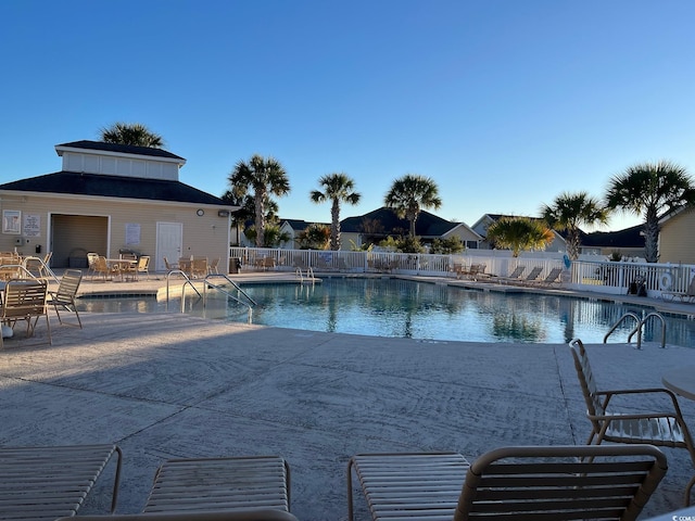 237 Cloverleaf Dr, Longs, SC 29568 - community pool featuring a patio and fence