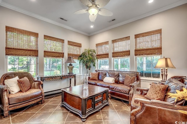 living area with visible vents, dark tile patterned flooring, and ornamental molding