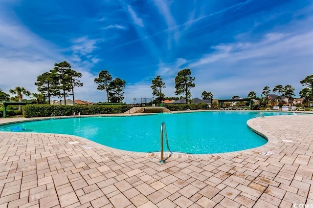 community pool with a patio