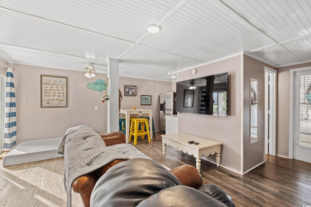 living room featuring dark hardwood / wood-style floors and ceiling fan