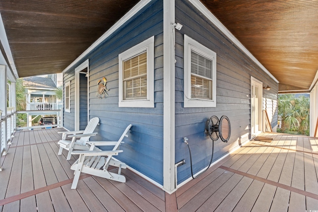 wooden terrace featuring covered porch