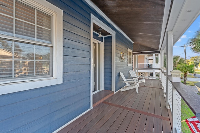 wooden terrace featuring a porch