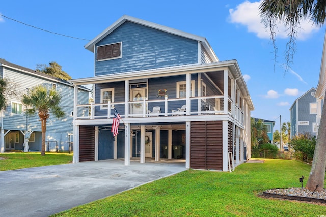 coastal home with a front lawn and a balcony