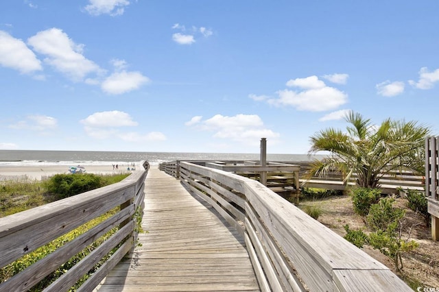view of community with view of water and beach