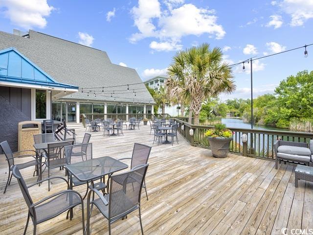 deck with outdoor dining area