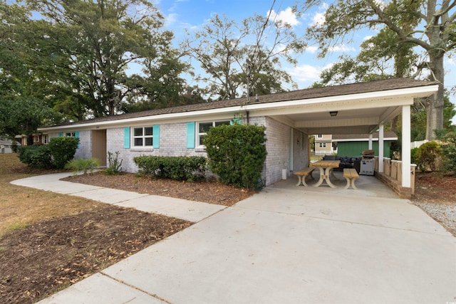 ranch-style house with a carport