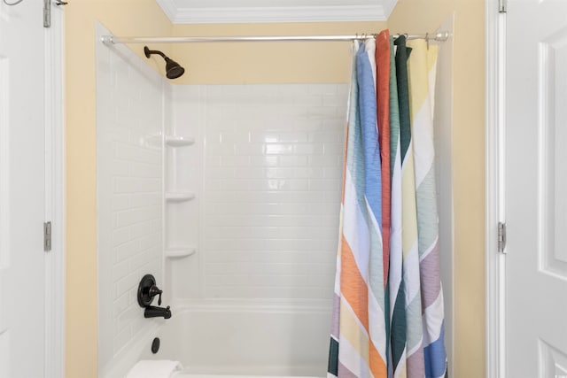 bathroom with ornamental molding and shower / bathtub combination with curtain