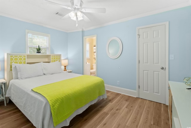 bedroom featuring light hardwood / wood-style floors, ceiling fan, connected bathroom, and crown molding