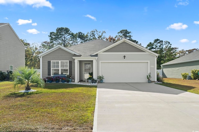 view of front of home featuring a front lawn and a garage